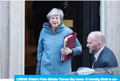  ?? —AFP ?? LONDON: Britain’s Prime Minister Theresa May leaves 10 Downing Street in central London yesterday ahead of Prime Minister’s Questions (PMQs).