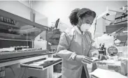  ?? MAX GERSH/THE COMMERCIAL APPEAL ?? Lab technician Zenobia Neal sets up for a COVID-19 test at Poplar Healthcare in Memphis in July of 2020. Local labs are acquiring the ability to detect a new variant of SARS-COV-2, the virus that causes COVID-19, which experts believe may be already spreading in the region.