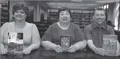  ??  ?? Dalton State’s Roberts Library has 20 sets of books to loan for an upcoming Civil War book discussion series. Above: from left: Heather Shores of the Bandy Center; Lydia Knight, library director and John Fowler of the Bandy Center.