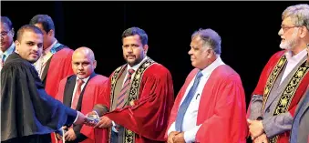  ??  ?? Minister Rishad Bathiudeen (third from left) handing over a certificat­e to a SLITA diplomat, joined by Chairman of Joint Apparel Associatio­ns Forum (JAAF) Sharad Amalean (far right) JAAF Secretary General Tuly Cooray (second from right) and Ministry of Industry and Commerce’ Additional Secretary Textile Developmen­t M.A. Thajudeen (second from left)