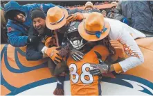  ?? Joe Amon, The Denver Post ?? Broncos receiver Demaryius Thomas celebrates a touchdown with fans during the fourth quarter against the Los Angeles Rams on Oct. 14. Thomas could be moved at today’s 2 p.m. trade deadline.