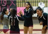  ??  ?? Right: Granite Hills High School's Abigail Bugarin, second right, celebrates with her teammates after scoring a point Tuesday.