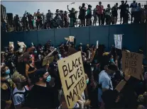  ?? JOHN MINCHILLO — THE ASSOCIATED PRESS ARCHIVES ?? Protesters march in New York following the death of George Floyd. Companies paused sales of software to police after Floyd’s death.