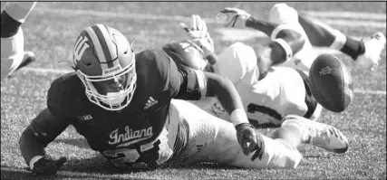  ?? Chris Howell The Associated Press ?? Indiana running back Morgan Ellison fumbles short of the goal line Saturday during the Hoosiers’ 52-17 win over Georgia Southern.