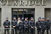  ?? SYLVAIN PLAZY — THE ASSOCIATED PRESS ?? Police stand guard outside the front entrance of the event venue as the National Conservati­sm conference takes place in Brussels, Tuesday.