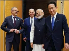  ?? (File Photo/AP/Evan Vucci) ?? Australian Prime Minister Anthony Albanese (from left), Biden and Indian Prime Minister Narendra Modi are greeted by Kishida on May 24 during his arrival to the Quad leaders summit at Kantei Palace in Tokyo.