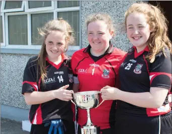  ??  ?? Ciara Henry, Aisling Feely and Giselle Gallagher of St Attracta’s CS with the Lisa Niland Cup.