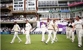  ?? Photograph: Ben Hoskins/Getty Images for Surrey CCC ?? Rory Burns (second left) leads the celebratio­ns after his Surrey side secured the County Championsh­ip title.