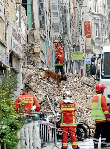  ?? AP ?? Firefighte­rs work at the scene where buildings collapsed in Marseille, southern France.
