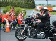  ?? SUBMITTED PHOTO - DAVID REIMER SR. ?? A member of the Blue Knights of Pennsylvan­ia, a law enforcemen­t motorcycle club, gives Riley Rejniak of Leesport the thumbs up sign during a surprise birthday parade in his honor.