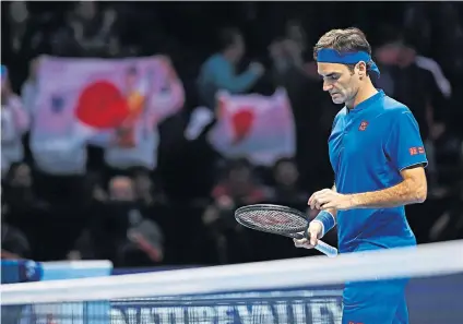  ??  ?? Looking down: Roger Federer during his straight-sets defeat against Kei Nishikori in London last night