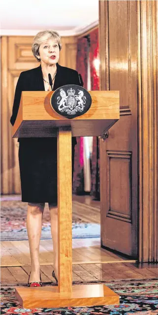  ??  ?? Under fire: British Prime Minister Theresa May makes a statement on Brexit at 10 Downing Street.