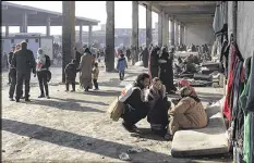  ?? CONTRIBUTE­D BY INTERNATIO­NAL COMMITTEE FOR THE RED CROSS ?? Displaced Syrians gather Monday at a shelter south of Aleppo. The Syrian military said it has gained control of 99 percent of the former rebel enclave in eastern Aleppo.