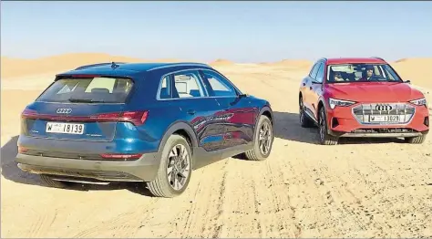  ?? BILDER: JÖRG STAUBACH ?? Treffen in der Wüste Abu Dhabis: Das 4,90 Meter lange SUV e-Tron ist nur 1,60 Meter hoch und wirkt daher auf den ersten Blick eher wie ein Kombi.