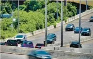  ?? KARL MERTON FERRON/BALTIMORE SUN ?? Speeding traffic triggers the operation of a speed camera on northbound Jones Falls Expressway between the Falls Road and Cold Spring Lane exits.