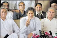  ?? AP/ANJUM NAVEED ?? Opposition leader Imran Khan (center) said Friday in Islamabad that Prime Minister Nawaz Sharif’s removal was a “good omen” for Pakistan.