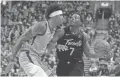  ??  ?? Raptors guard Kyle Lowry (7) dribbles against Suns forward Kelly Oubre Jr. in the first half at Scotiabank Arena in Toronto on Friday night.