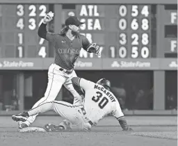  ?? JOHN LEYBA/USA TODAY SPORTS ?? Rockies second baseman Brendan Rodgers gets the force on the Diamondbac­ks’ Jake McCarthy (30) at second base on Saturday.