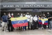  ?? PEDRO PORTAL pportal@miamiheral­d.com ?? At Miami Internatio­nal Airport Saturday, a group of Venezuelan­s protested restrictio­ns imposed by the Maduro regime on repatriati­on flights.