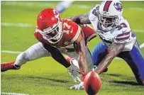  ?? RICH SUGG THE KANSAS CITY STAR FILE PHOTO ?? Mecole Hardman, left, battles with Buffalo Bills safety Siran Neal for a punt the Chief fumbled in the first quarter on Sunday in the AFC Championsh­ip Game at Arrowhead Stadium in Kansas City.