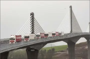  ??  ?? A convoy of Nolan Transport trucks were the first vehicles to cross the new bridge.