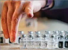  ?? The Canadian Press ?? Empty vials of the Pfizer-BioNTech COVID-19 vaccine are seen in this handout photo.