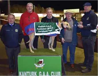  ??  ?? Tom O’Callaghan, Chairman, Kanturk GAA, making a presentati­on to Patrick Barrett, Millstreet, following Dims Zero’s win in the Kanturk Ladies Football Club 525 at the club’s fundraiser at Curraheen Park. Included are Jackie Carroll, Jerry Murphy and Brian Collins, Racing Manager. Picture: Mike English