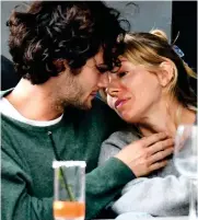  ?? ?? Getting personal: The pair laugh over drinks in Notting Hill Lean in: The couple prepare for a kiss...