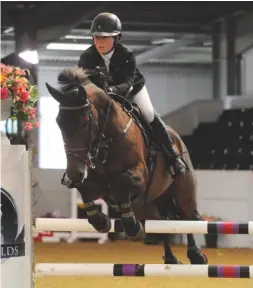  ??  ?? Emily Ward heads the young rider grand prix with Millioninm­ind