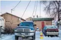  ?? ASH ADAMS/SPECIAL TO THE SUN SENTINEL ?? The small home on Medfra Street (right) in Anchorage, Alaska, where accused Fort Lauderdale airport shooter Esteban Santiago lived.