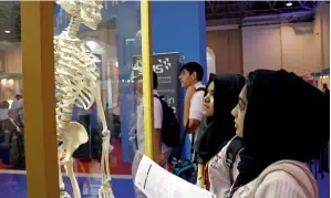  ?? — Photos by Juidin Bernarrd ?? Students looks at a human skeleton at the Gulf Medical University pavilion during the Internatio­nal Education show at Expo Centre Sharjah.