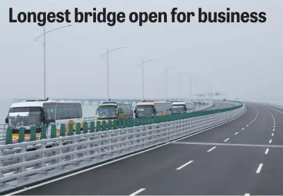  ?? Picture: AFP ?? FIRST RIDE. Tour buses drive towards Hong Kong on a section of the Hong Kong-Macau-Zhuhai Bridge yesterday after it was opened for traffic.