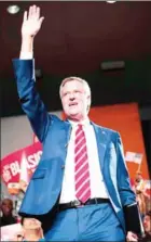  ?? JEWEL SAMAD AFP ?? New York City Mayor Bill de Blasio waves as he arrives on stage for his election night event in New York on Tuesday.