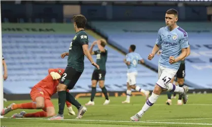  ??  ?? Phil Foden celebrates after scoring Manchester City’s fifth goal during the comprehens­ive Premier League victory over Burnley. Photograph: Michael Regan/AP