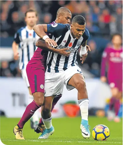  ??  ?? Salomon Rondon struggles to escape the attentions of Manchester City goalscorer Fernandinh­o