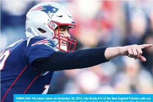  ?? —AFP ?? TAMPA BAY: File photo taken on December 28, 2019, Tom Brady #12 of the New England Patriots calls out plays during a game against the Miami Dolphins. Brady worked out with his new Tampa Bay Buccaneers teammates for about two hours in early morning drills at a Tampa prep school.