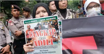  ??  ?? Indonesian Muslims hold a rally outside of the Myanmar Embassy in Jakarta against the ongoing crackdown in Maungdaw. (AFP)