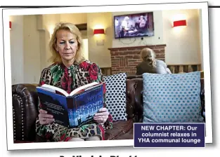  ??  ?? NEW CHAPTER: Our columnist relaxes in YHA communal lounge