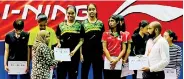  ??  ?? Teshani Nayanathar­a and Hasara Wijerathna receiving their gold medals during the presentati­on ceremony after winning the women’s doubles at the South Asian U-21 Regional Badminton Championsh­ip held in Addu City, Maldives