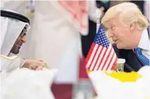  ?? BANDAR AL-JALOUD/AFP/GETTY IMAGES ?? A picture provided by the Saudi Royal Palace on Sunday shows Abu Dhabi Crown Prince Mohammed bin Zayed al-Nahayan chatting with President Donald Trump during a meeting with leaders of the Gulf Cooperatio­n Council in Riyadh.