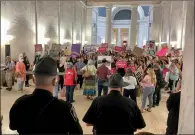  ?? JOHN RABY / AP ?? Capitol police officers watch over a group of abortion rights protesters on Friday outside the West Virginia Senate chambers in Charleston.