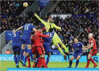  ??  ?? LEICESTER: Huddersfie­ld Town’s Danish goalkeeper Jonas Lossl (C) punches the ball clear during the English Premier League football match between Leicester City and Huddersfie­ld Town at King Power Stadium in Leicester, yesterday. — AFP