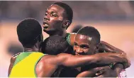  ?? RICARDO MAKYN/MULTI MEDIA PHOTO EDITOR ?? St Jago High’s Leon Clarke (top) is surrounded by teammates after he piloted his team to victory in the 4x800 metres for high school boys at last month’s Gibson McCook Relays.