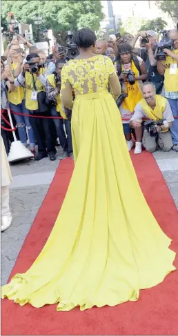  ?? PICTURE: CINDY WAXA ?? TRAILBLAZE­R: Public Protector Thuli Madonsela was the clear winner in the fashion stakes at the State of the Nation Address on Thursday, in her sweeping, canary yellow gown by Gert-Johan Coetzee.