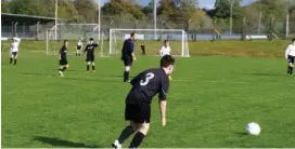  ??  ?? Real Tubber’s Cian Gallagher lines up a free- kick.