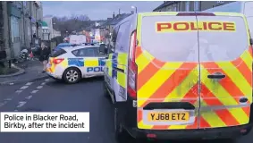  ??  ?? Police in Blacker Road, Birkby, after the incident