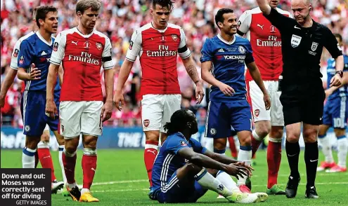  ?? GETTY IMAGES ?? Down and out: Moses was correctly sent off for diving