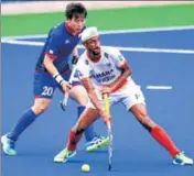  ?? AP ?? Japan's Masaki Ohashi (left) vies for possession with Mandeep.