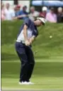  ?? STEW MILNE — THE ASSOCIATED PRESS ?? Bubba Watson hits his approach shot onto the second green during the final round of the Travelers Championsh­ip golf tournament Sunday in Cromwell, Conn.