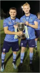  ??  ?? Arklow’s Daire O’Connor and Liam Scales celebrate after helping UCD to the First Division crown.